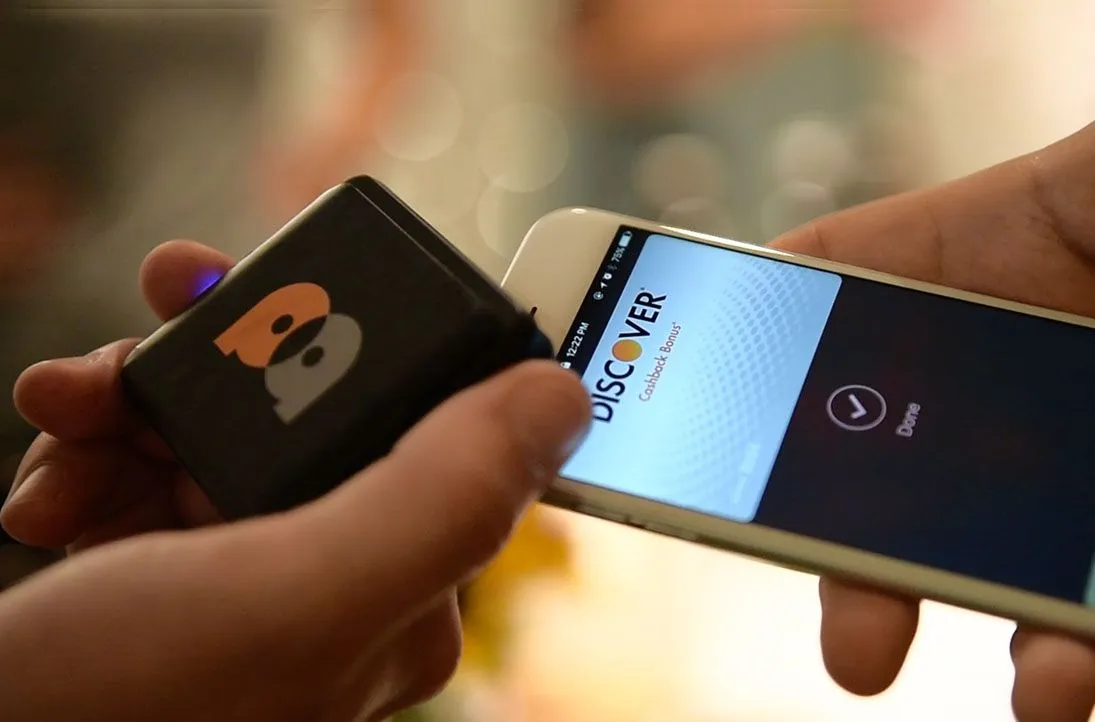 Contactless card payment being tapped on a card reader