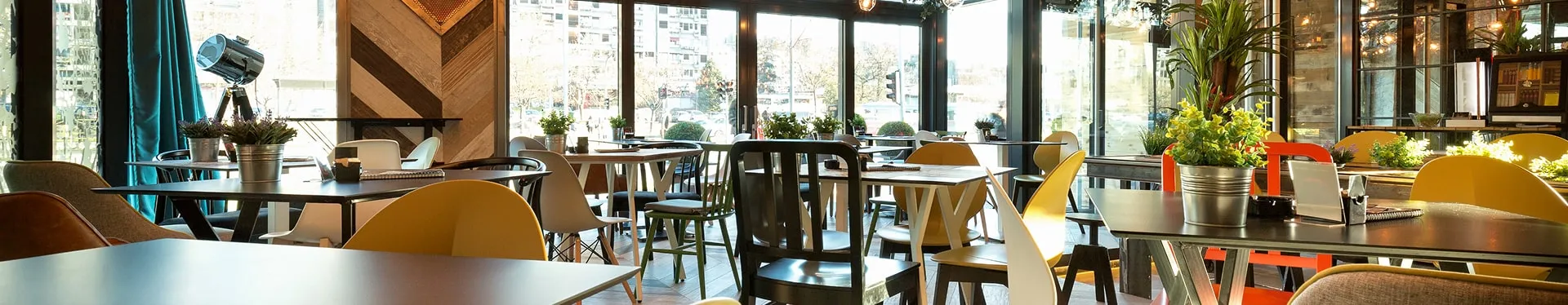 Dining room of a restaurant seen from the pass