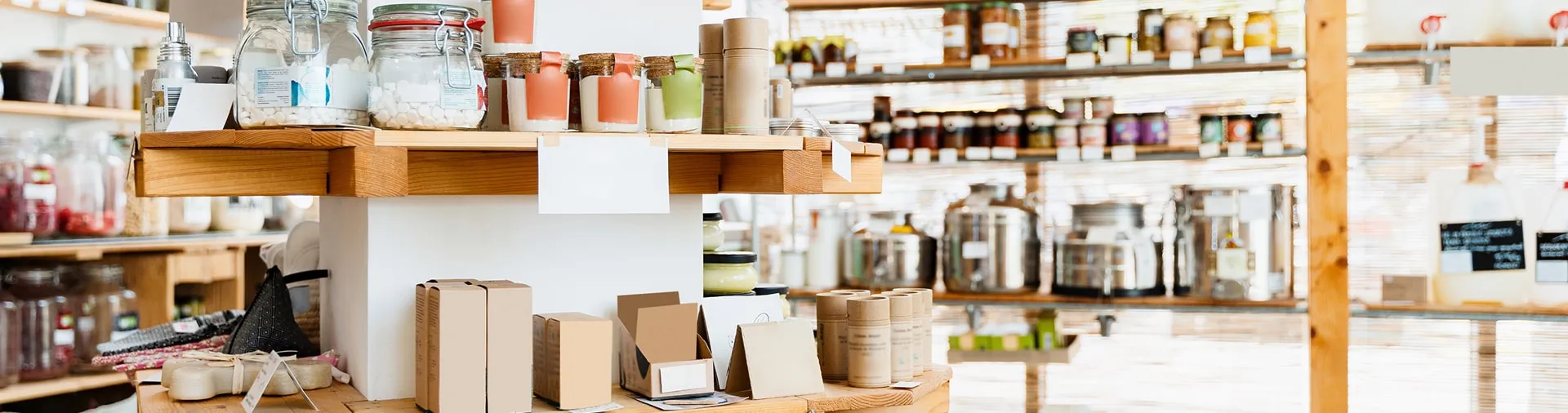 Shelves of packaged goods and jars in a neighborhood shop